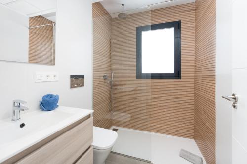 a bathroom with a shower and a toilet and a sink at R-40-B Luxury Villa with pool in Los Montesinos