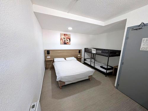 a small room with a bed and a bunk bed at Class'Eco Namur in Namur
