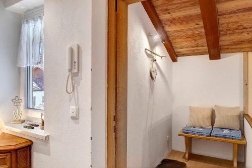 a room with a door and a phone on the wall at Andis Ferienwohnung in Farchant