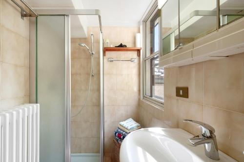 a bathroom with a sink and a shower at Casa Savin 35 in Pontboset