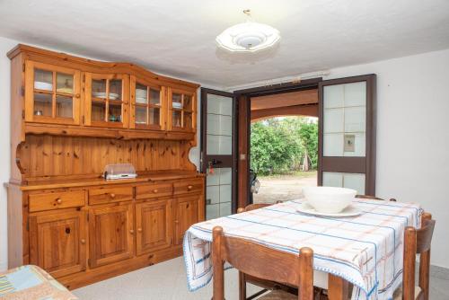 a kitchen with a table with a bowl on it at Runcina 2 in San Teodoro