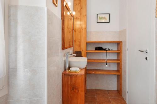 a bathroom with a sink and a toilet and a shower at B&B San Giovanni in Teglio