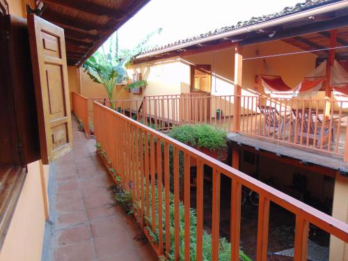 an outside view of a building with a balcony at Hotel El Maltese in Granada
