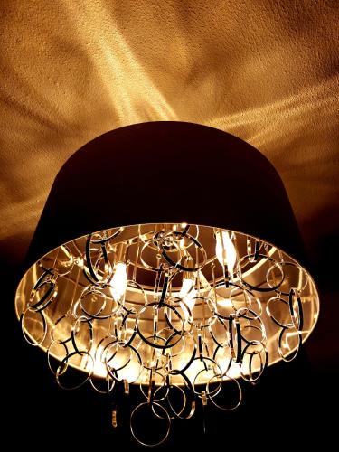 a close up of a chandelier with lights on it at Bloom! exclusive boutique b&b in Playa del Carmen