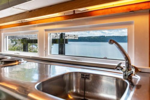 a sink in a kitchen with a window at Adlerhorst über dem Bodensee in Sipplingen