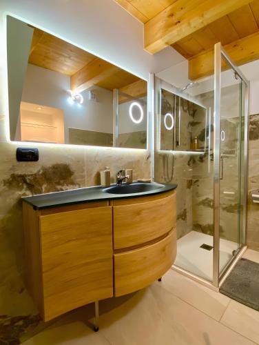 a bathroom with a sink and a shower at Alpi Liguri - Villa Giulia in Peveragno
