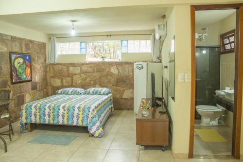 Кровать или кровати в номере Chalés Ima Teva