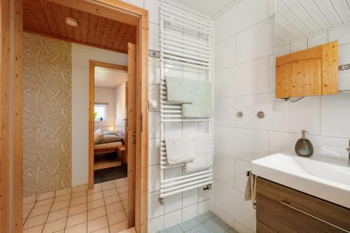 a bathroom with a sink and a shower at Ferienhäuschen Kleine Auszeit in Seesbach