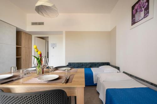 a room with two beds and a table with two sinks at Tenuta Vigna Corallo - Mimosa in Otranto