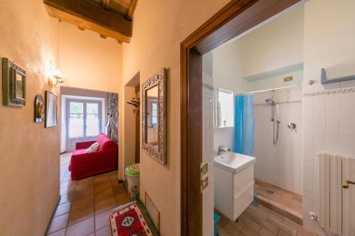 a bathroom with a toilet and a sink at Casa Pel di Lupo in Rosignano Marittimo