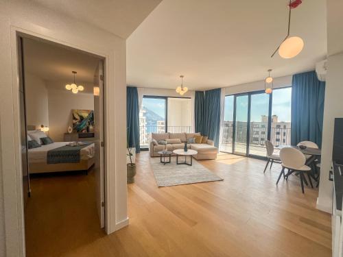a living room with a couch and a table at Sobre Suites in Bečići