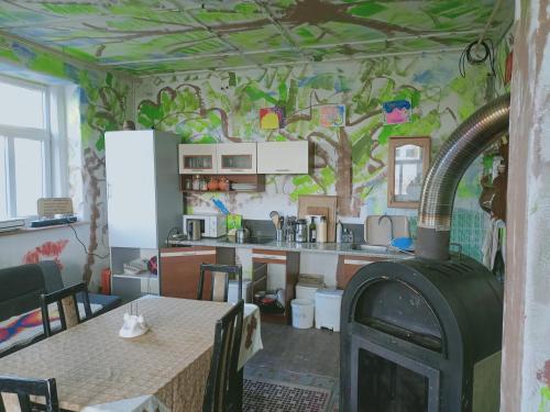 a room with a kitchen with a stove in it at Ubytování v galerii in Zlatá Olešnice