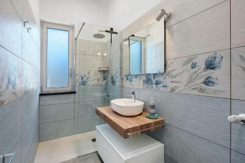 a bathroom with a sink and a toilet at Casa Vacanza Anni' in Vico Equense