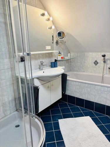 a bathroom with a toilet and a sink and a tub at Mmapartment in Feistritz ob Bleiburg