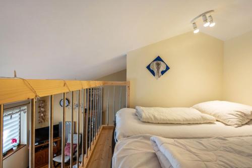 a bedroom with two beds in a room at all u need 4 holiday - fewo44 in Mühlthal
