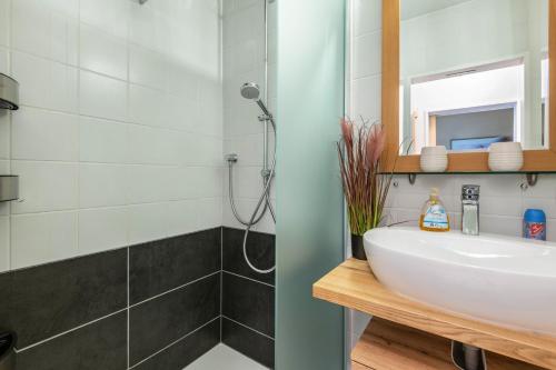 a bathroom with a sink and a shower at all u need 4 holiday - fewo44 in Mühlthal