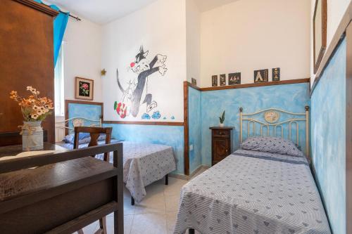 a bedroom with two beds in a room at Casa Loretta 3 in Valledoria