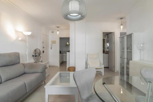 a living room with a couch and a table at Casa Ricardo in Barbate