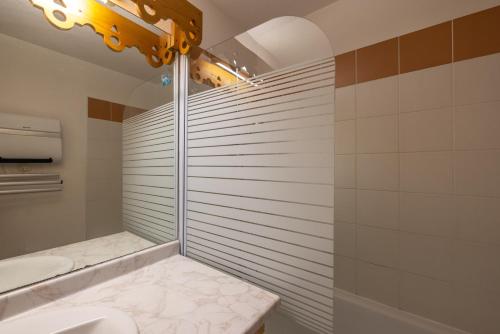 a bathroom with a shower and a sink and a toilet at Appt le grand Tetras D20 in Samoëns