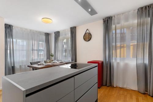 a kitchen with a sink and a counter top at Ferienwohnung Merlin in Ettenheim
