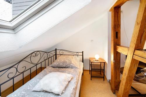a bedroom with a bed in a attic at Vogelsberger Bett 5 die 2 in Alsfeld