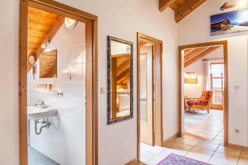 a bathroom with a sink and a mirror at Ferienwohnung Kramer in Grainau