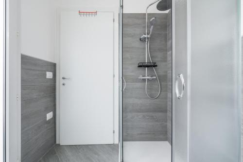 a shower with a glass door in a bathroom at Casa Andrea in Assemini