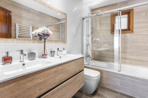 a bathroom with a sink and a toilet and a shower at Sa Vinya de Son Bou in Sóller
