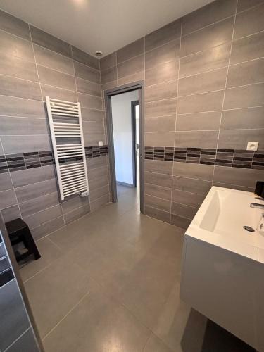 a bathroom with a sink and a white sink at Villa Lucia in Narbonne