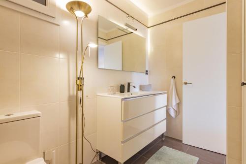 a bathroom with a sink and a mirror at Casa Lagos - 046 in Caleta De Velez