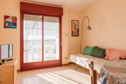 a living room with a sliding glass door at Appartamento C - Le Terrazze in Ribera