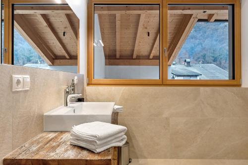 a bathroom with a sink and a mirror at Matscherhof Lana in Lana