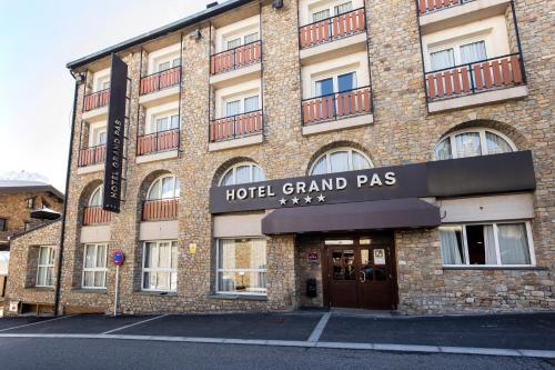 a building with a hotel grand pass sign on it at Hotel Grand Pas by Nexta in Pas de la Casa