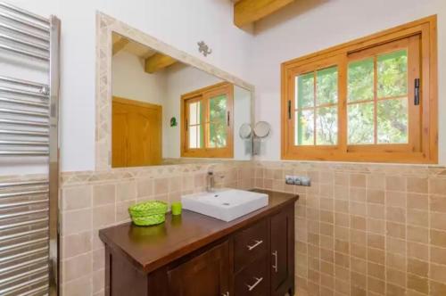 a bathroom with a sink and a mirror at Sa Sargantana in Islas Baleares
