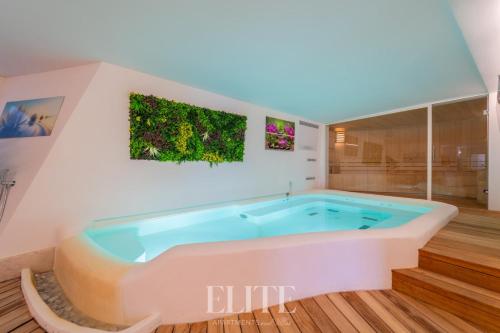 a bath tub in a room with at Elite Collection Villa Noemi in Porto Rotondo