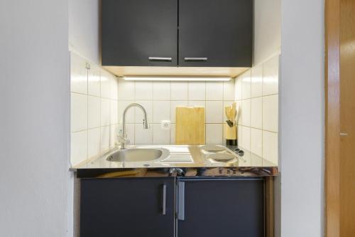 a kitchen with a sink and a counter top at Ferienidyll Zwiesel in Zwiesel