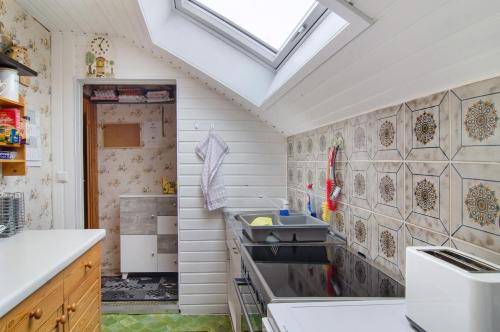 a small kitchen with a sink and a window at Ferienwohnung Hofer in Kalkofen