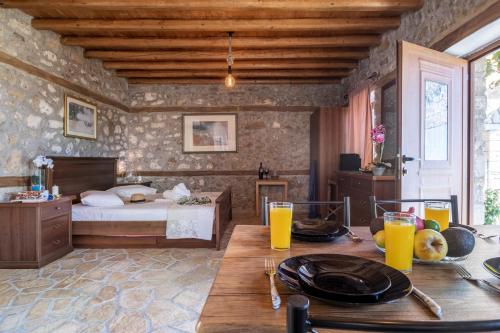 a bedroom with a bed and a table with plates on it at Villa Lazar in Lefkada