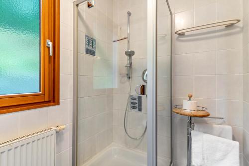 a bathroom with a shower and a sink at Haus Sum in Oberwolfach