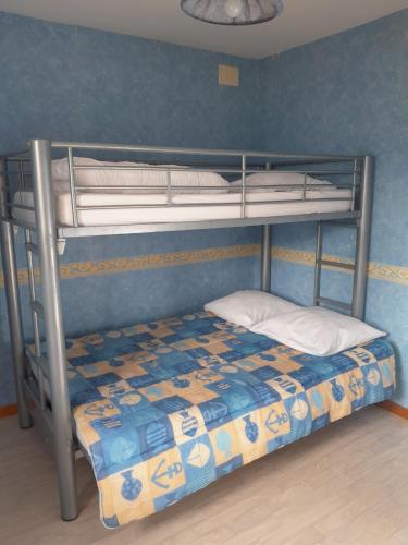 a bunk bed with a bottom bunk in a room at la fontaine bénite in Seyssel