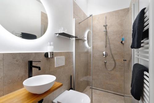 a bathroom with a toilet and a shower at Wolf's Apartment Ortenau in Renchen