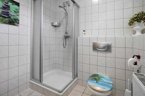a bathroom with a shower with a toilet in it at Forst Entdecken in Forst