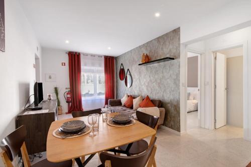 a living room with a table and a couch at Apartamento Brisas Do Mar in Porches