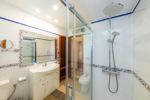 a bathroom with a shower and a sink and a toilet at Can Tiro in Islas Baleares