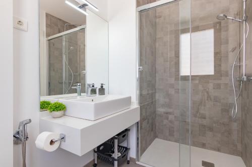 a bathroom with a sink and a shower at Adhara - 034 in Torre del Mar