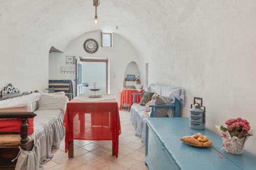 a living room with a couch and a table at Palatino in Astypalaia