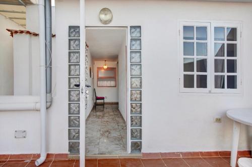 a hallway with a door leading into a room at Casa Marrero in La Guancha