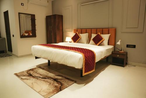 a bedroom with a large bed and a rug at Hemagiri Palace in Avati