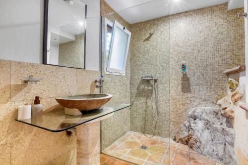 a bathroom with a sink and a shower at Caroix in Jávea