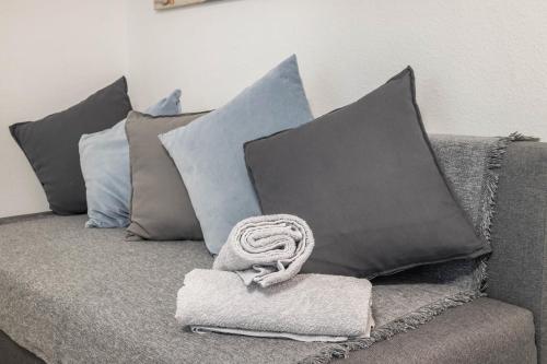 a couch with pillows and a towel on it at Ferienwohnung Heide 2 in Walsrode